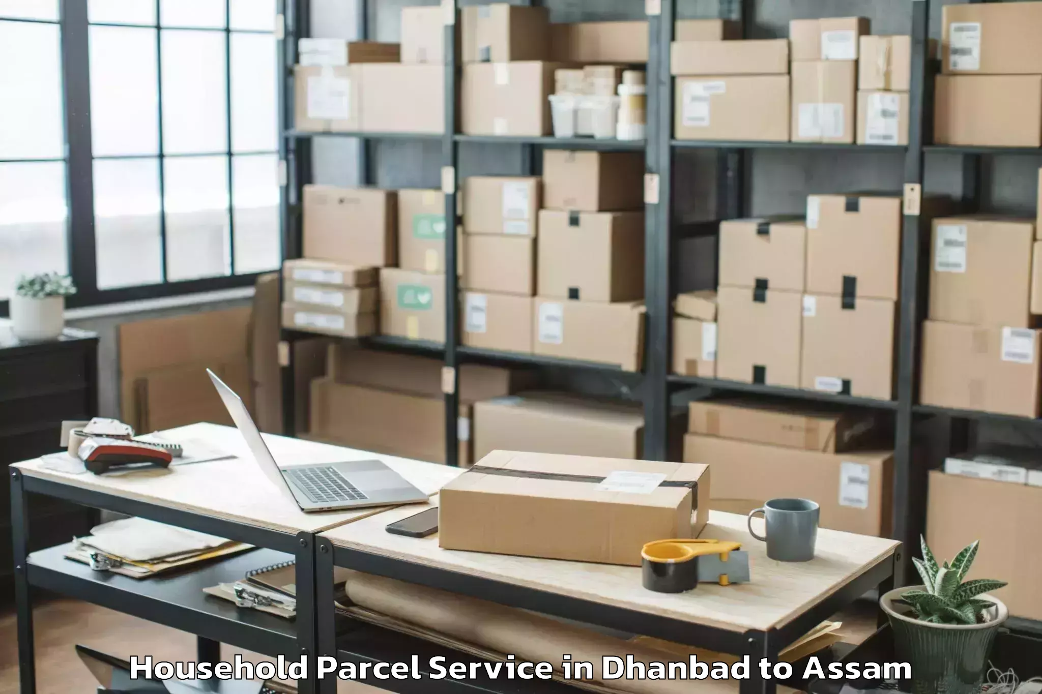 Book Dhanbad to Morigaon Household Parcel Online